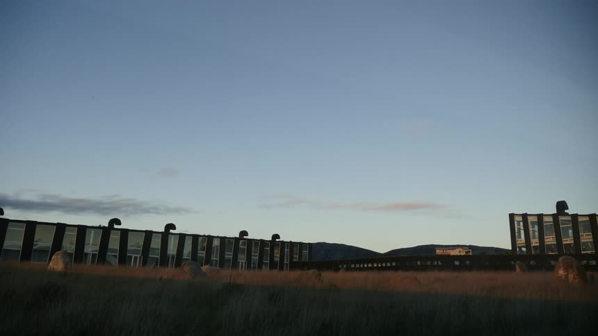 A pasture sees the approaching dusk