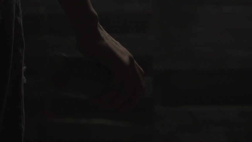 Person shaking a spray paint can in their hand