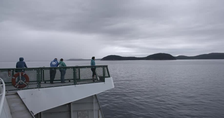 Spectators view the ocean from a viewing deck