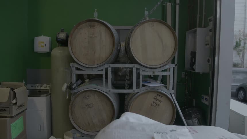 Four barrels and other equipment and supplies in a room