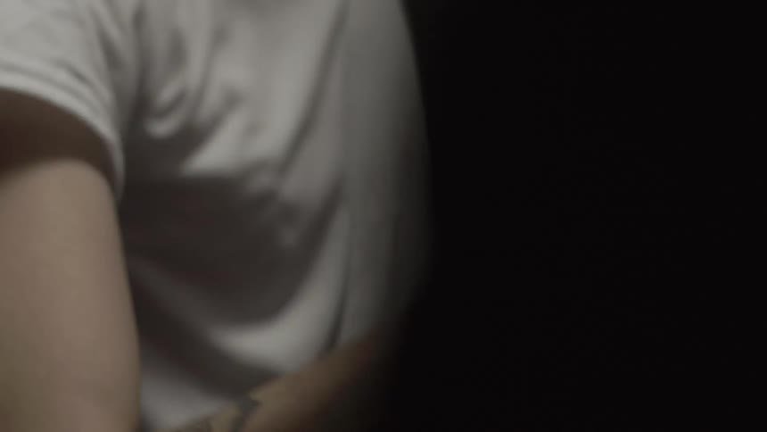 The tattooed arm of a person