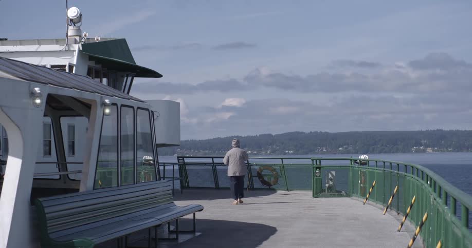 A person is walking on a ferry boat