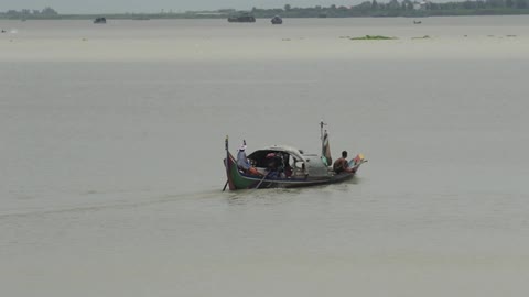 Boat gliding across a lake