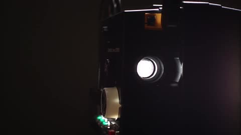 A film canister spinning on a reel