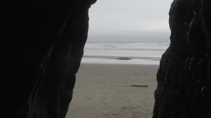 A vista of a beach from a rock