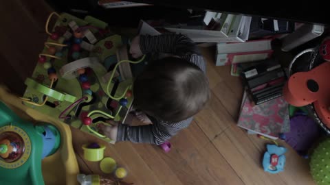 A child plays with an activity table
