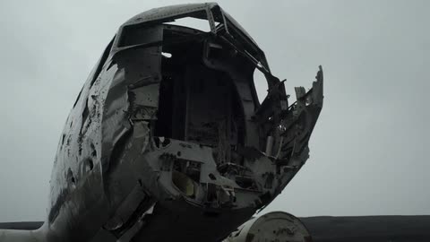The wreckage of a plane crash in an empty field