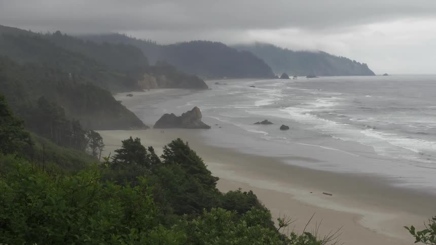Waves slowly rolling in on the coastline