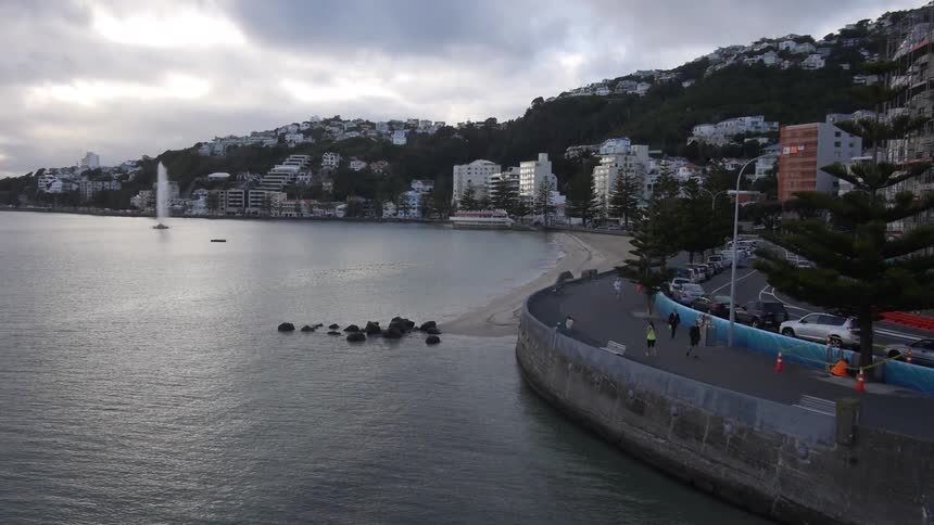 People are jogging alongside the ocean