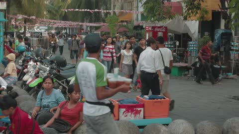 People walking down a busy city street