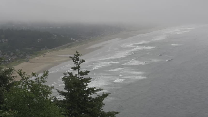 Ocean waves crash onto a sandy beach
