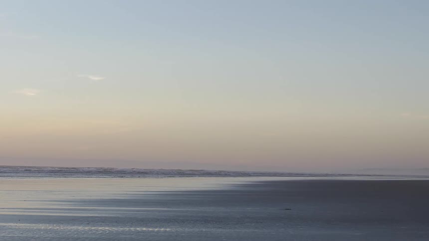 A scenery of calming sea at dawn