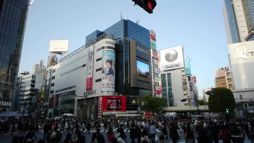 Pedestrians cross a street in an urban area