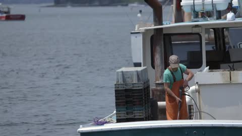 A man washes his boat
