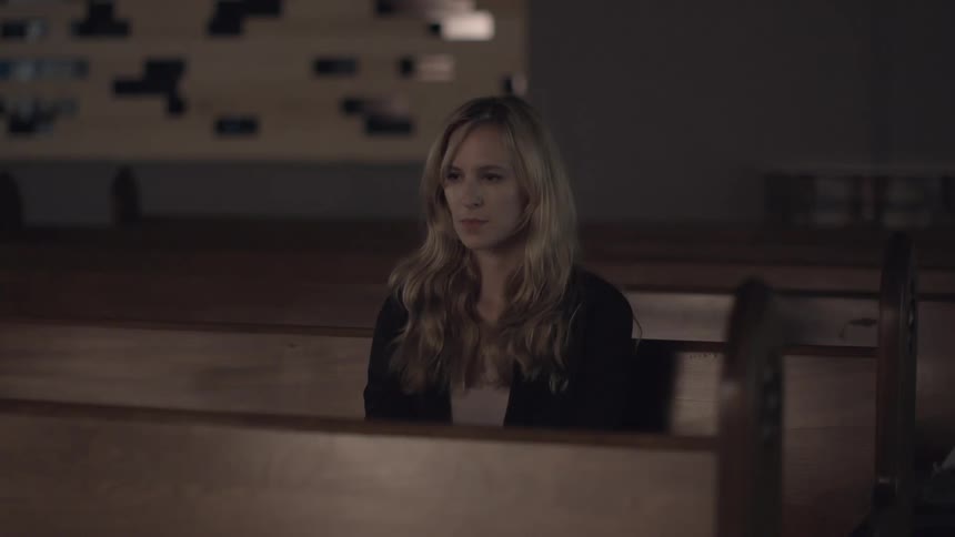 Woman sitting in a church pew