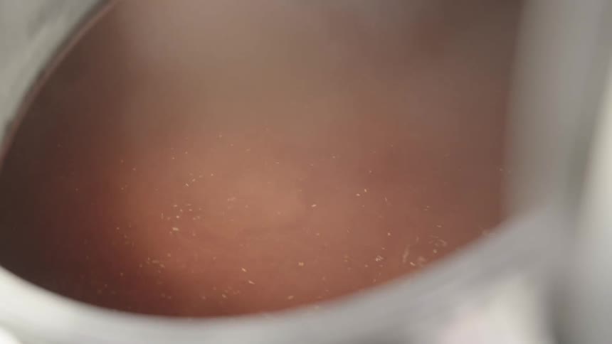 A steaming vat of liquid
