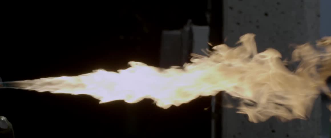 Flames billowing against a wall