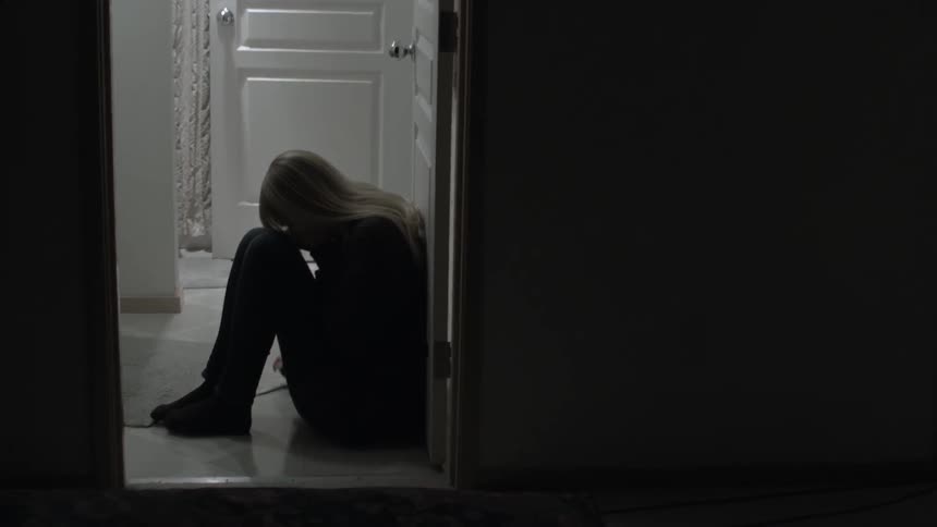 Woman drops down to the floor and starts crying