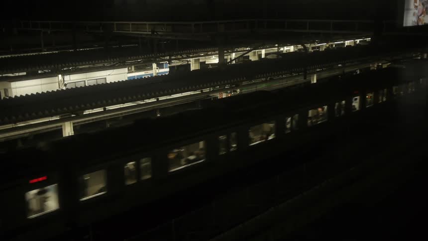 A train leaving the station at night