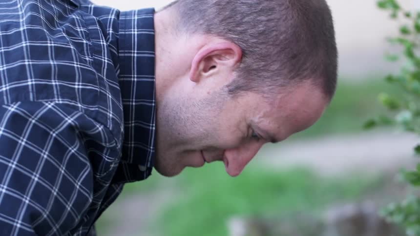 Man planting flowers in a garden