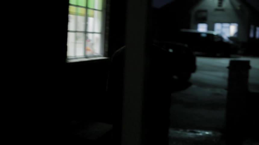 A person walking out of a door to go outside