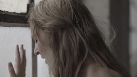 A person staring out of a window