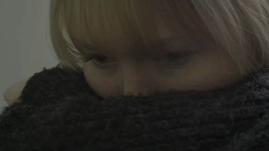 A sad woman hug herself