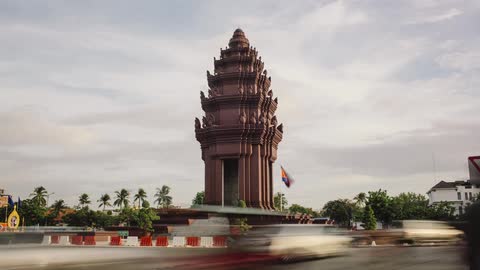 A time lapse of cars in front of a temple