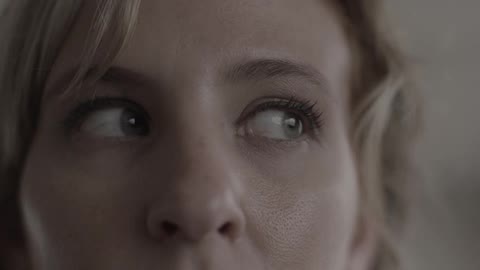 A woman looks to her left