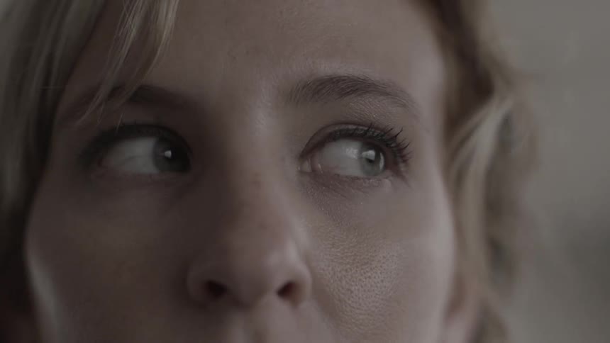 A woman looks to her left