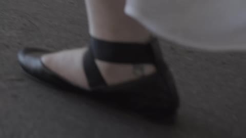 Woman walking wearing ballet slippers