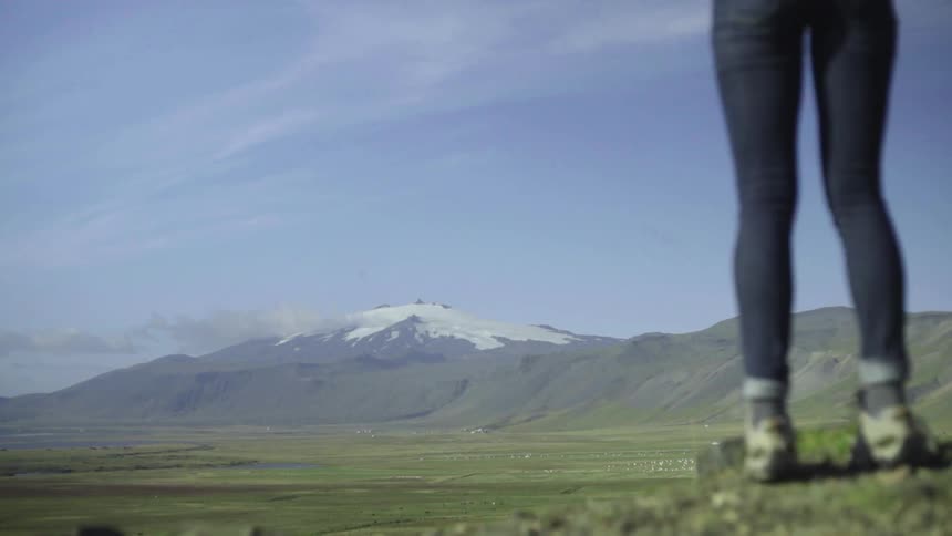 Woman backpacking in a remote mountainous area