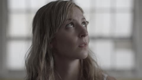 A young woman looking quizzical