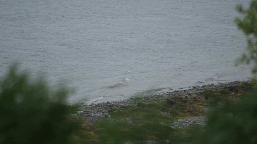Water coming into a rocky shore