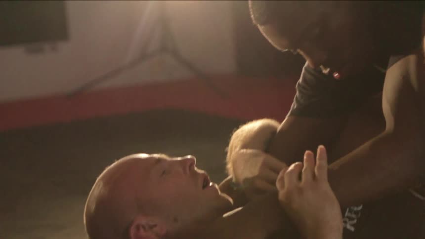 Two men fighting in wrestling match
