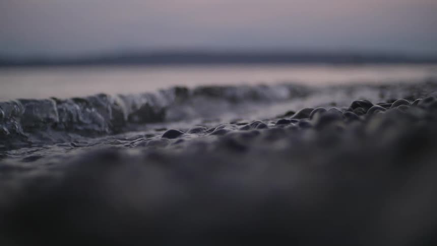 Waves roll onto a rocky beach