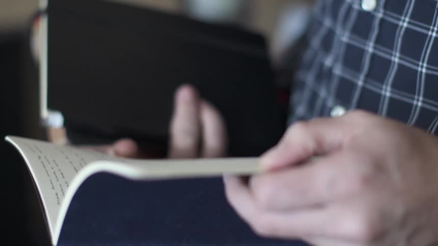 A person flipping thru a book