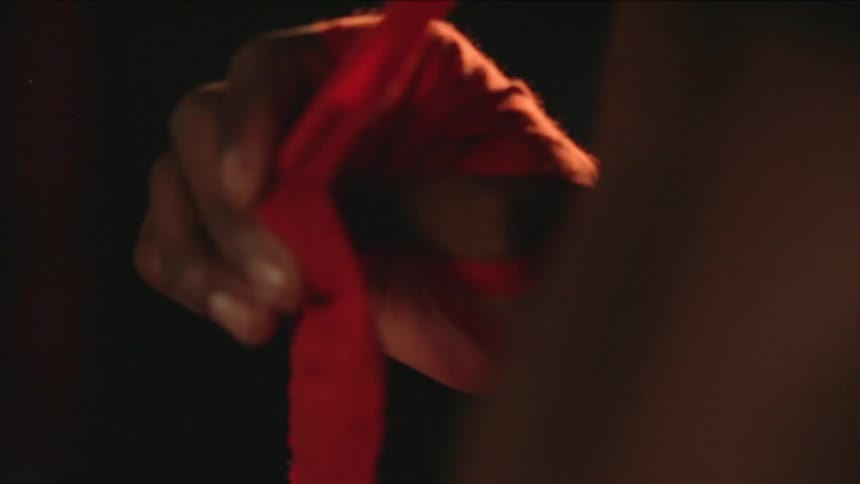 A person taping up for a fight