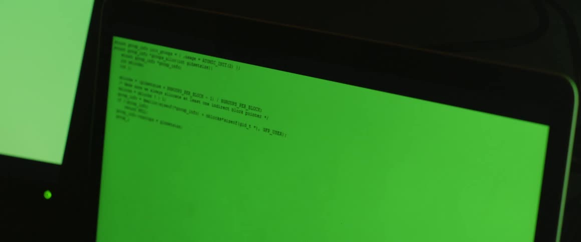 A green computer monitor with words typed on it