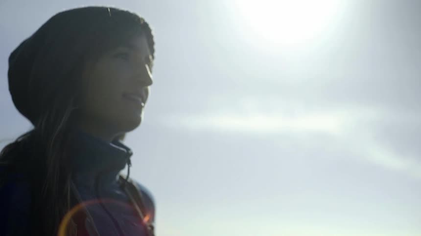 She sun shines down on a woman