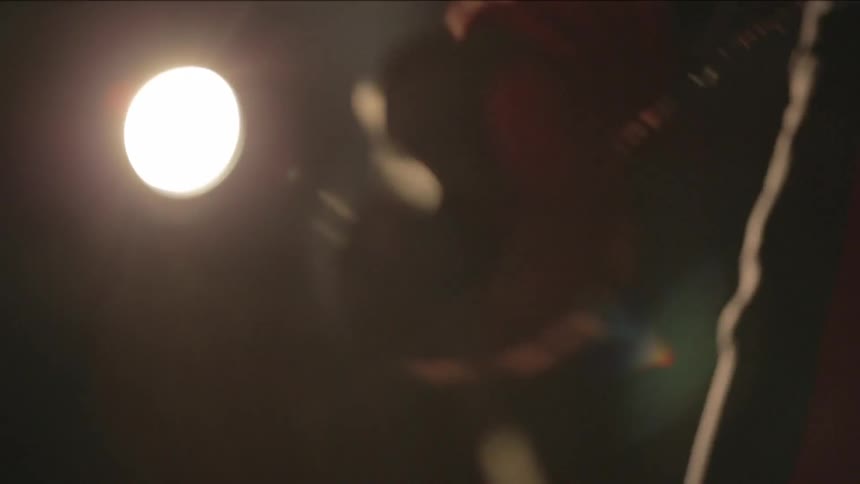 Man jumping rope in a dark room