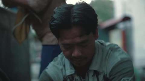 A person cutting a coconut