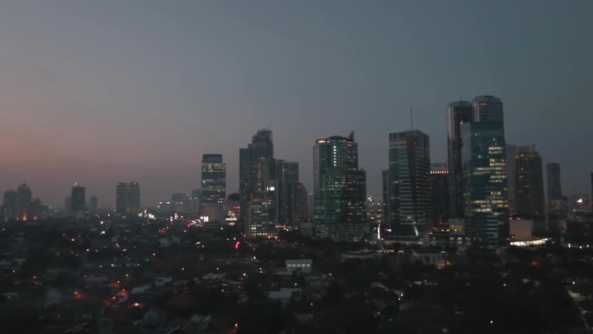 A large city at night coming into focus