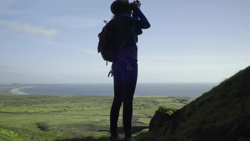 A person taking pictures of nature
