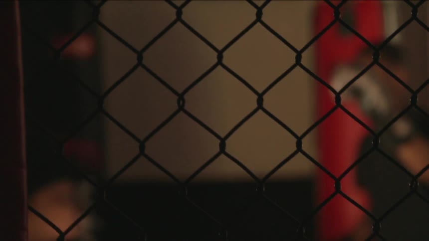 Two gloved boxers spar