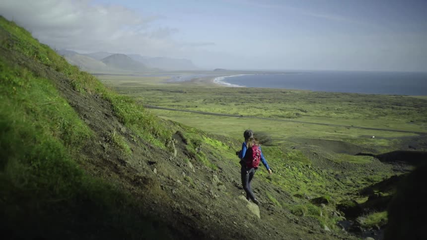 A woman hikes in the mountains