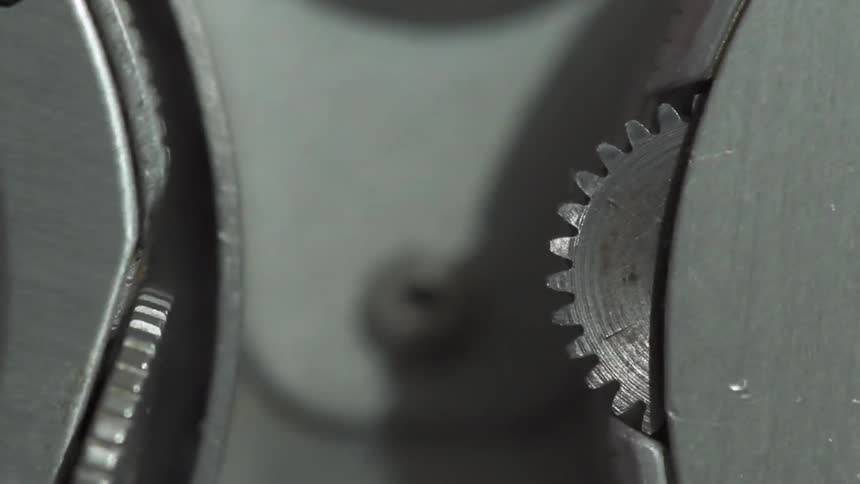 A piece of equipment with metal gears rotates