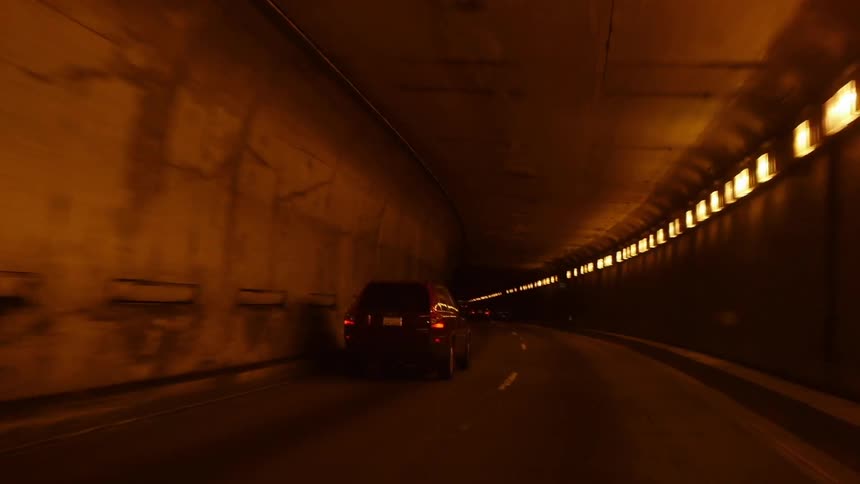 A car driving trough tunnel