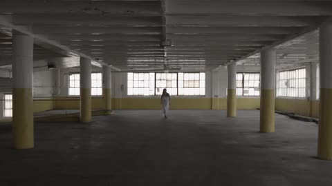 A person running through an abandoned building