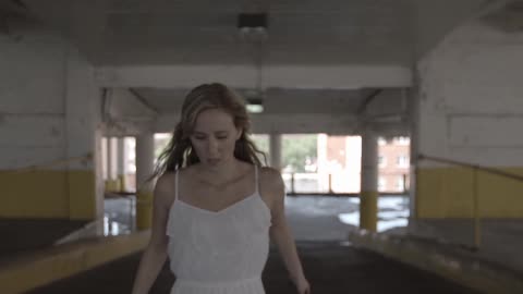 A person running in a car garage